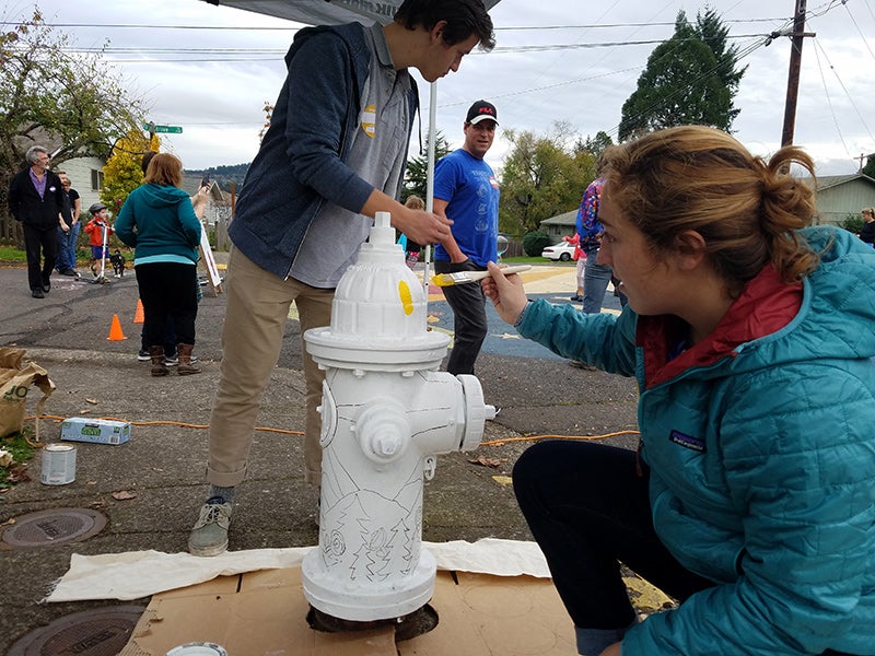 PPPM undergraduate Emily Fagan lays down the first spot of color