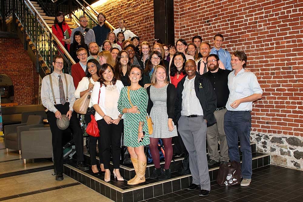 students pose for a photo on steps