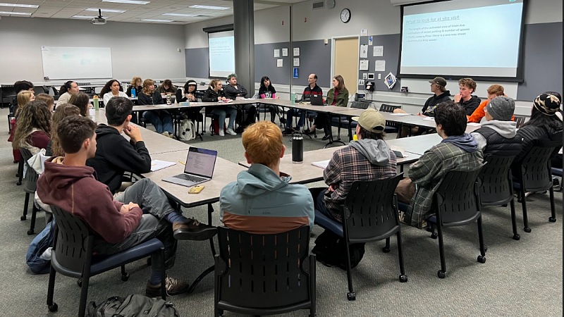 Photograph of a group presenting at Gresham. 