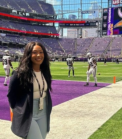 Naomi photograph on the Minnesota Vikings football team field. 