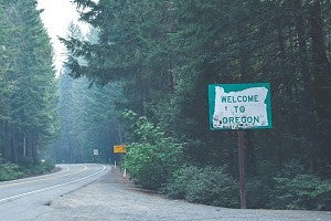 Photo of road in Oregon with welcome sign