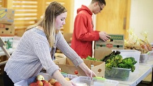 student prepares fruits and vegetables