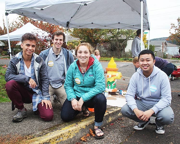 Andrei Eugenio, Gillian Garber-Yonts, Emily Fagan, and Brian Soutavong with fire hydrant they helped paint 