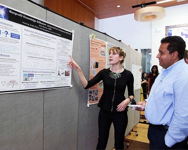 student presents work to Gerardo Sandoval