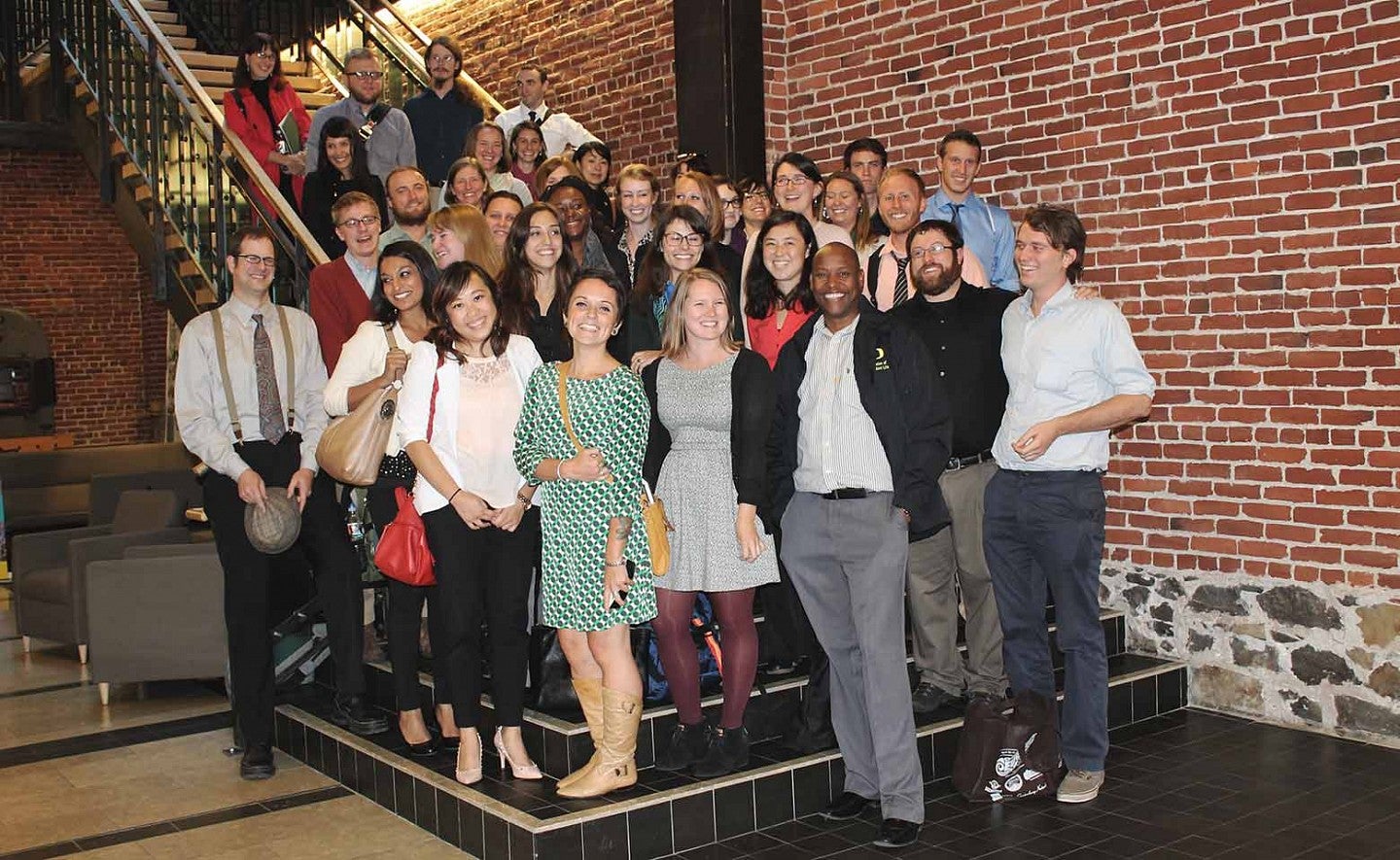 student group poses on steps