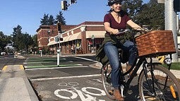 Person riding bike on a bikeway