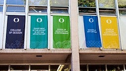 banners hang in the Lawrence Hall courtyard