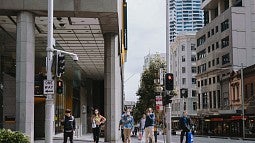 People standing on a city street corner