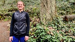 Portrait of alumna Megan Patrignelli in a forest