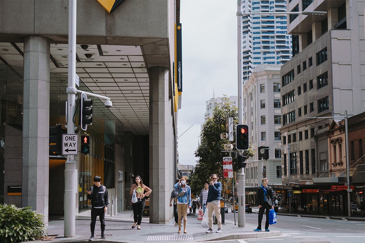 People standing on a city street corner